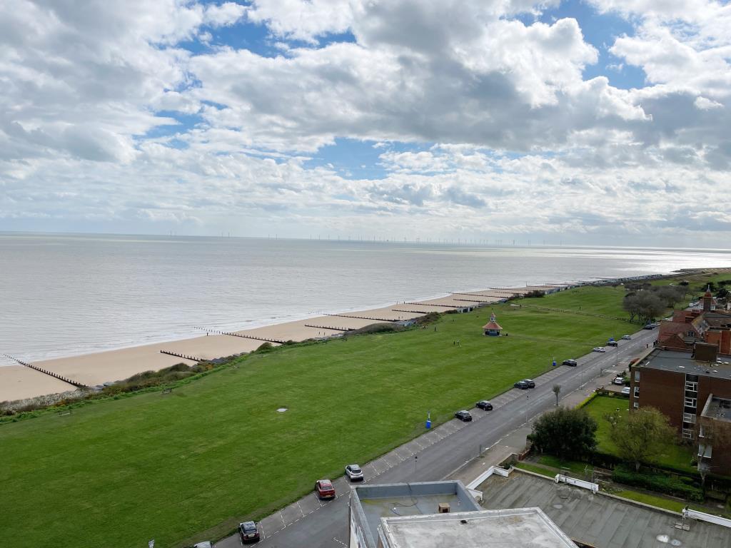 Lot: 137 - THREE-BEDROOM PENTHOUSE FLAT WITH COASTAL VIEWS - View of the greensward and beach at Frinton on Sea